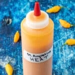 A bottle of St. Augustine Heat Hot Sauce, ready to serve