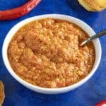 Ajvar (Serbian Roasted Red Pepper Relish) in a bowl with a spoon