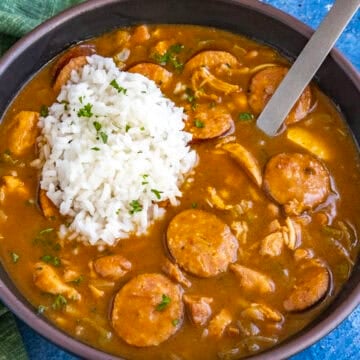Cajun Chicken and Sausage Gumbo served in a bowl with a scoop of white rice