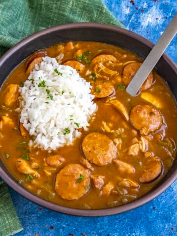 Cajun Chicken and Sausage Gumbo served in a bowl with a scoop of white rice