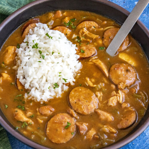 Cajun Chicken and Sausage Gumbo served in a bowl with a scoop of white rice