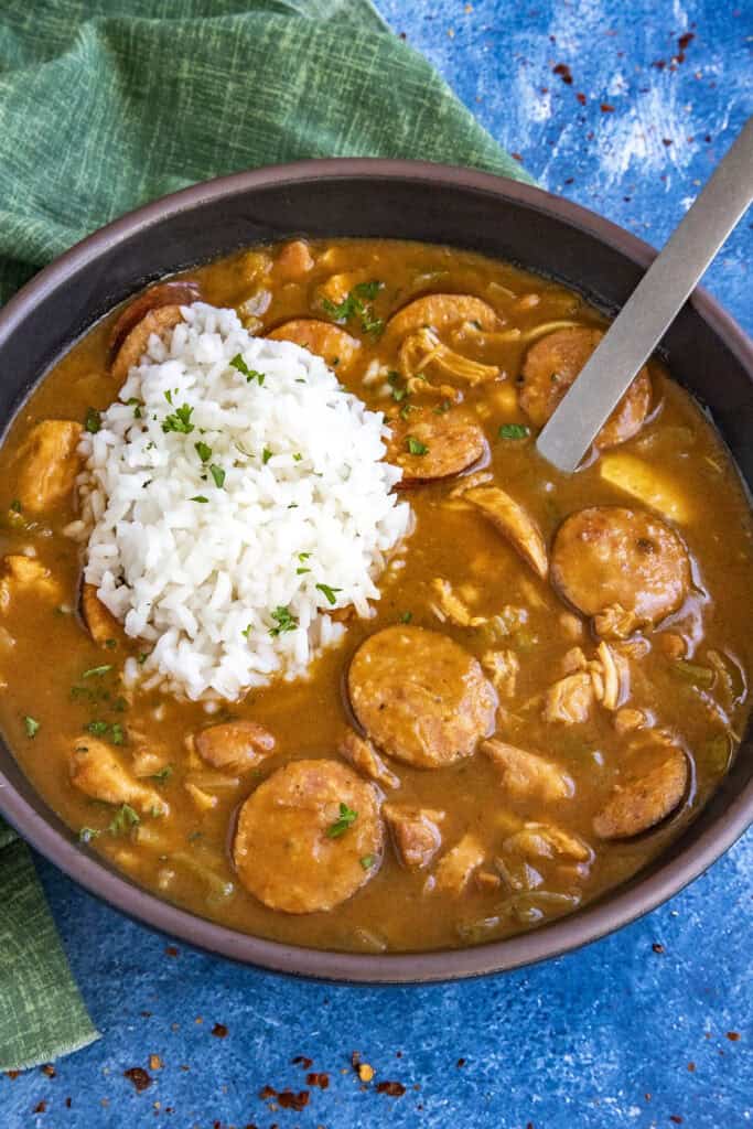 Cajun Chicken and Sausage Gumbo served in a bowl with a scoop of white rice