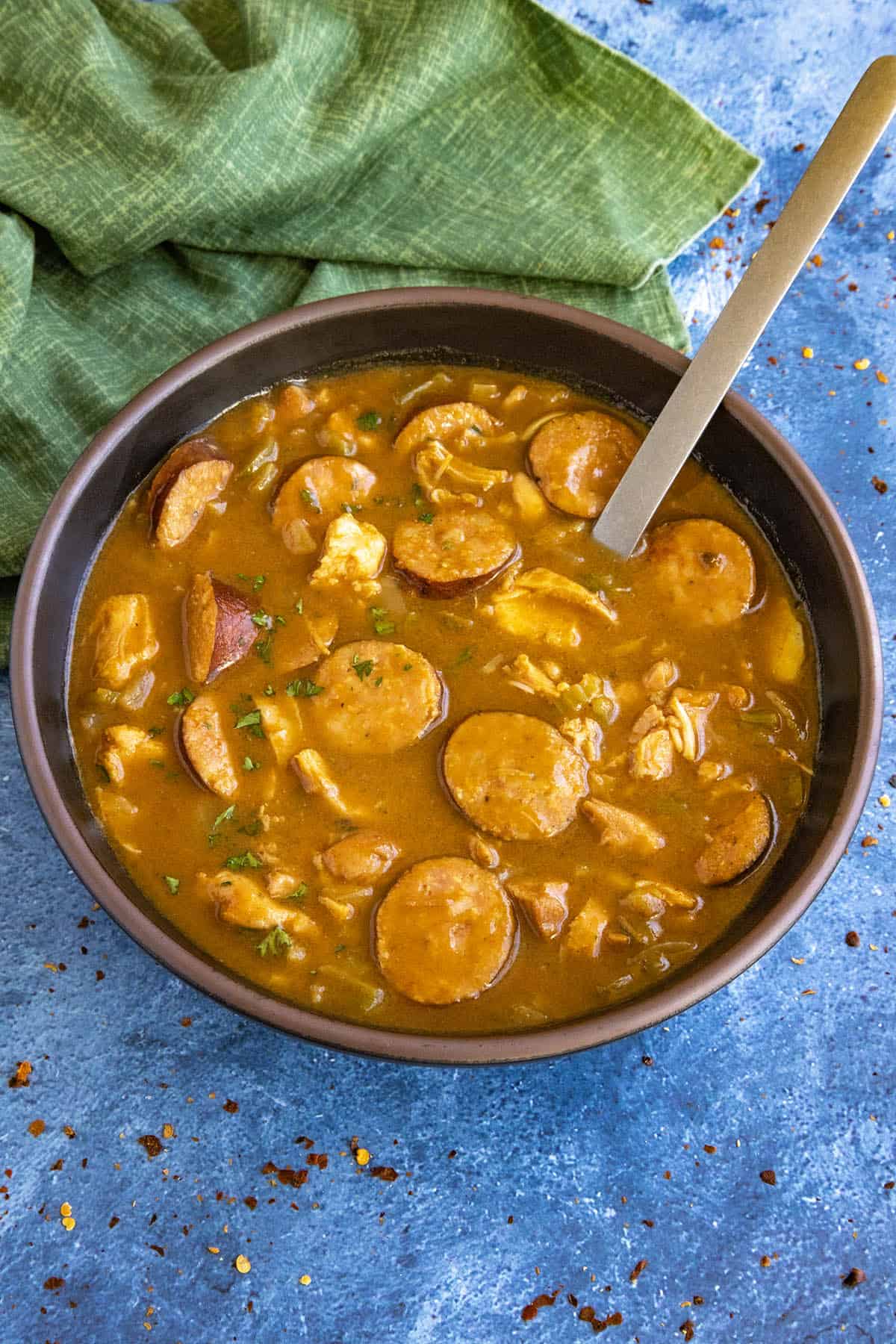 Cajun Chicken and Sausage Gumbo served in a bowl, garnished with fresh herbs