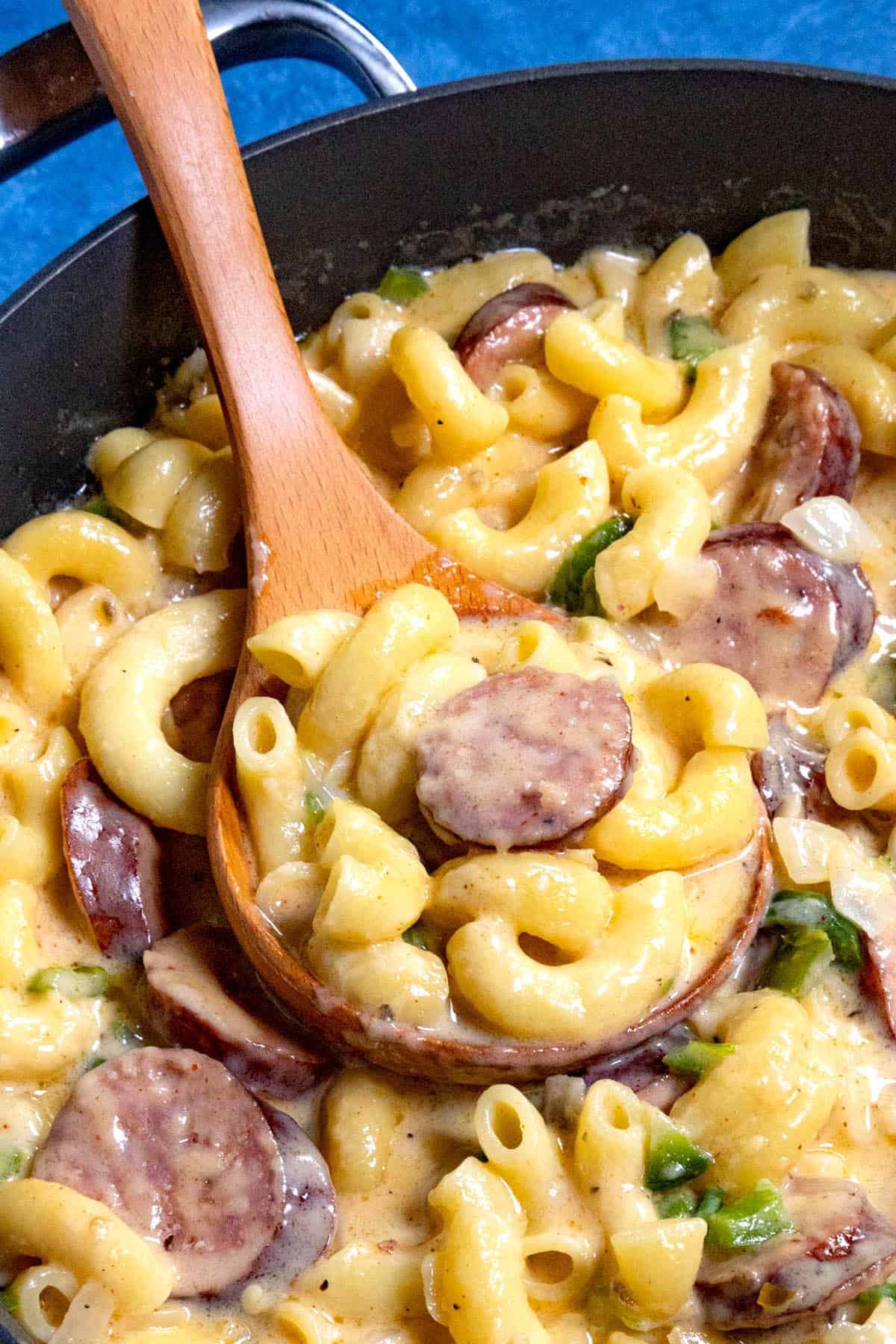 Serving a scoop of Cajun Mac and Cheese Recipe from the pan