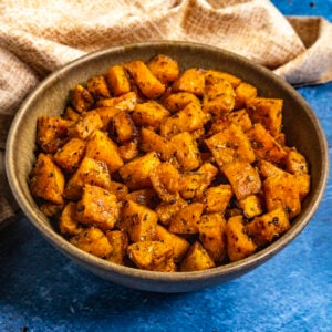 A large bowl filled with Spiced and Roasted Sweet Potatoes, ready for your dinner table