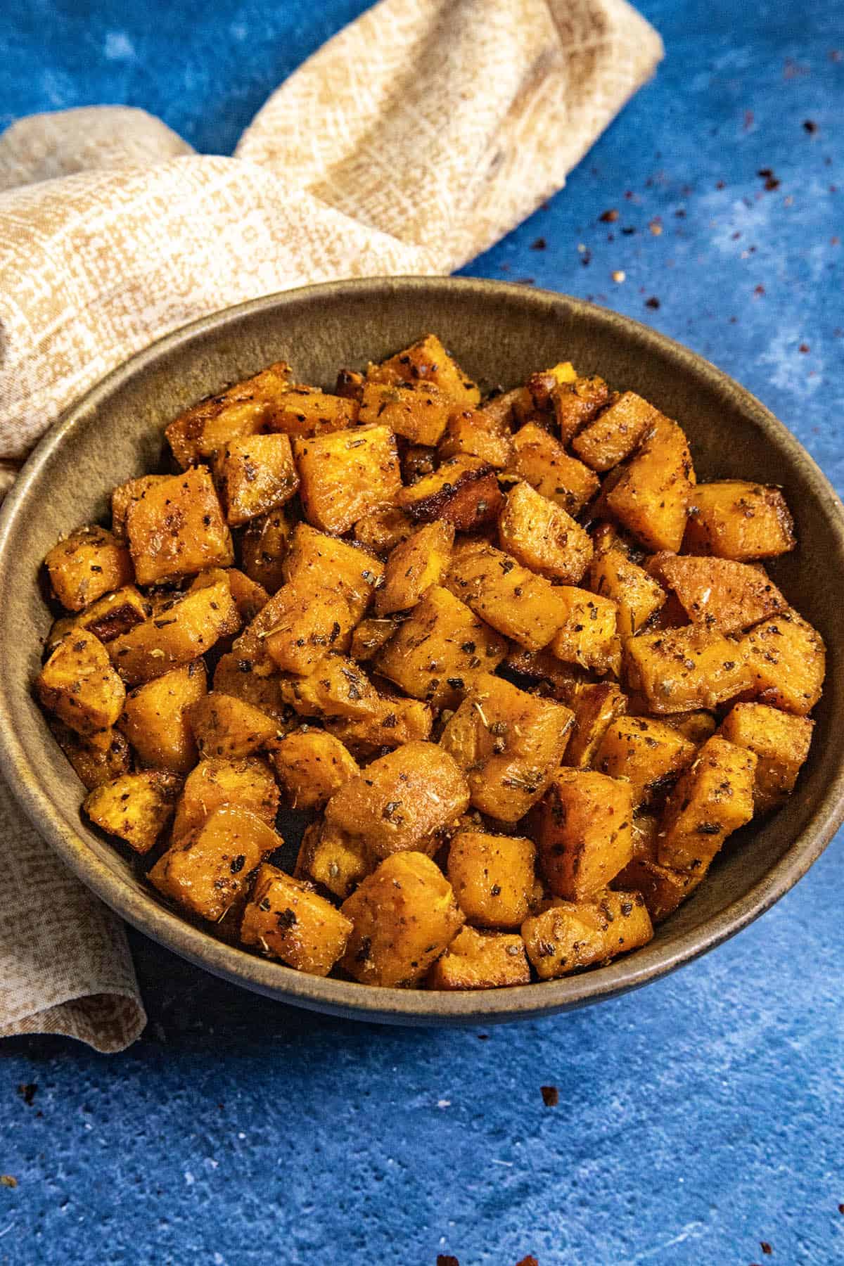 A bowl filled with spiced and Roasted Sweet Potatoes