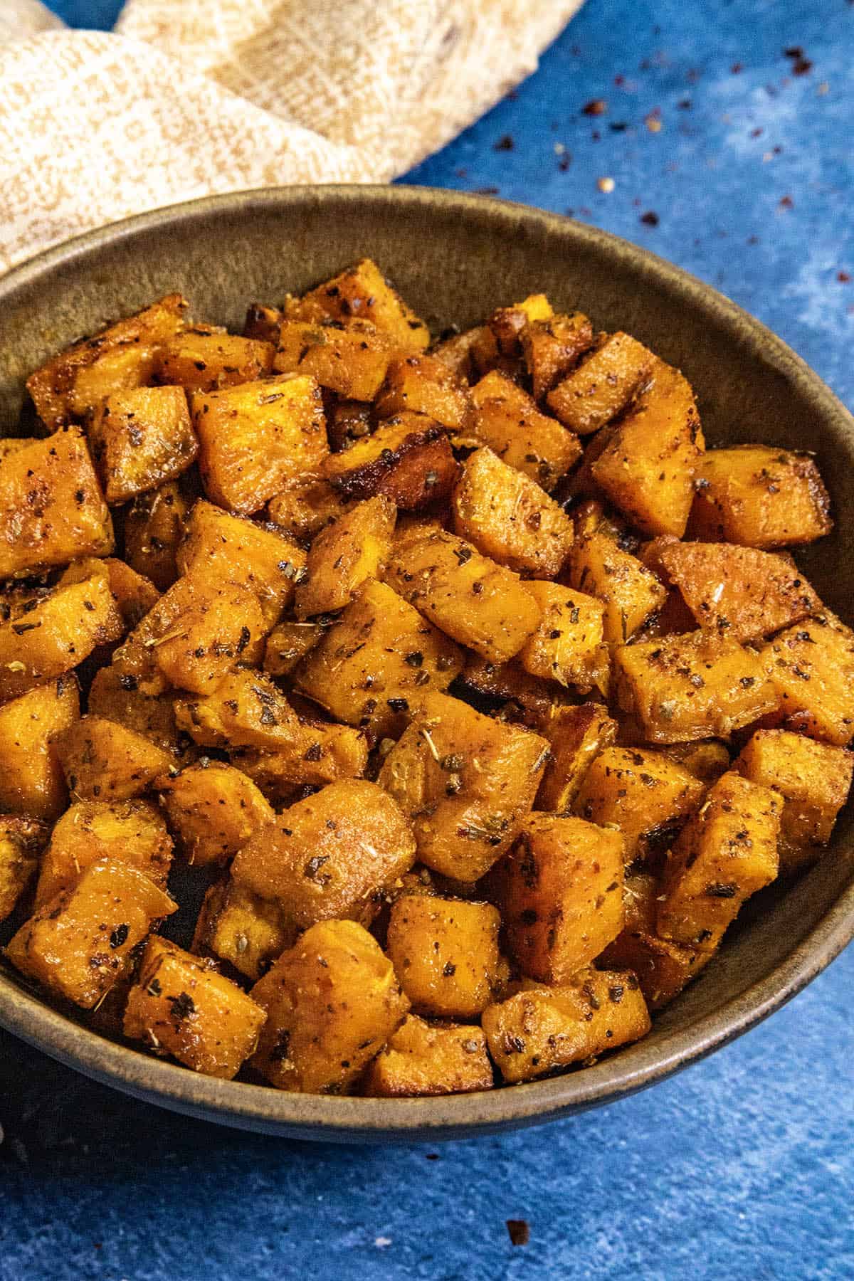 A bowl filled with spiced and Roasted Sweet Potatoes
