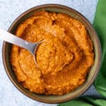 Thai Red Curry Paste in a bowl with a serving spoon