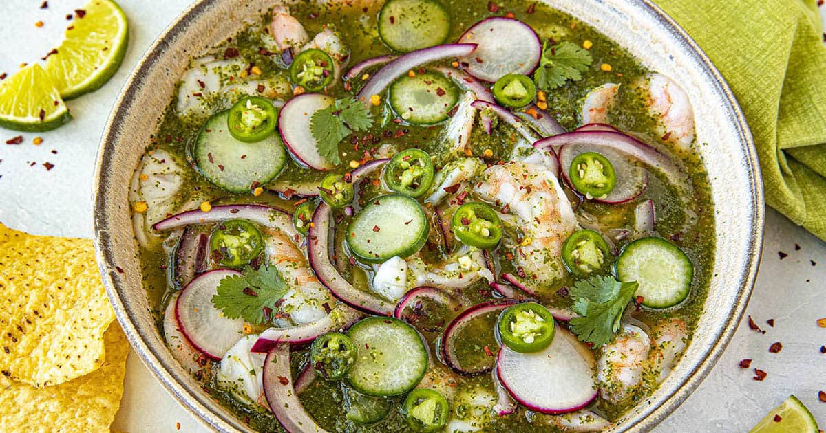 A bowl of spicy, Authentic Aguachile (Mexican Shrimp Ceviche), served with tortilla chips