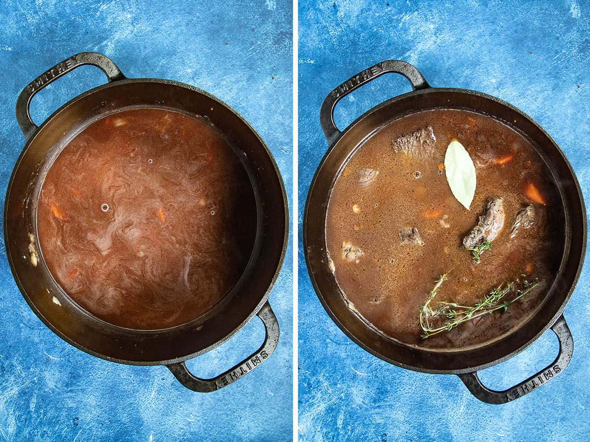 Simmering Beef Bourguignon in a pot with fresh herbs and bay leaf