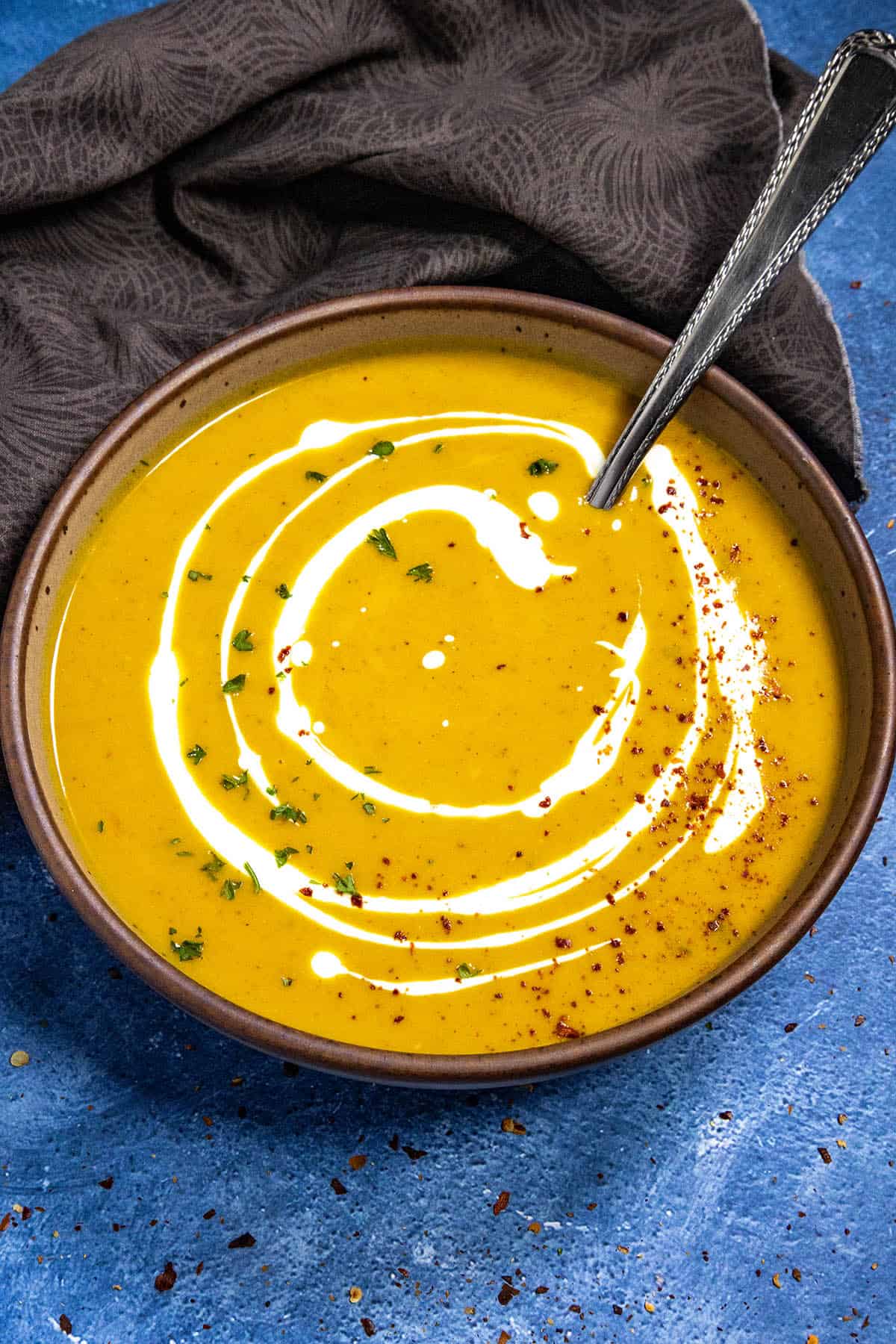 Curried Butternut Squash Soup served in a bowl with garnish