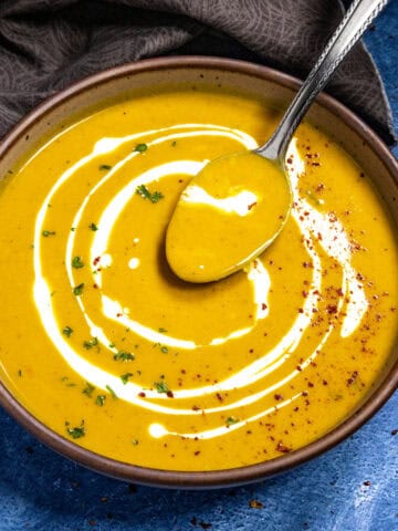 Mike taking a spoonful of Curried Butternut Squash Soup from the bowl