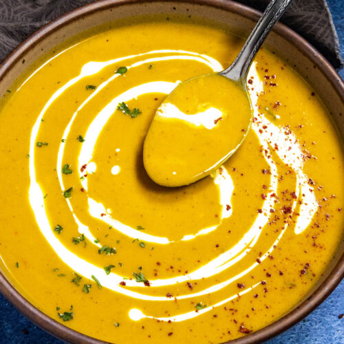 Mike taking a spoonful of Curried Butternut Squash Soup from the bowl