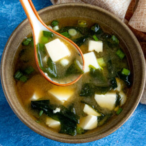A spoonful of homemade Miso Soup with tofu and seaweed