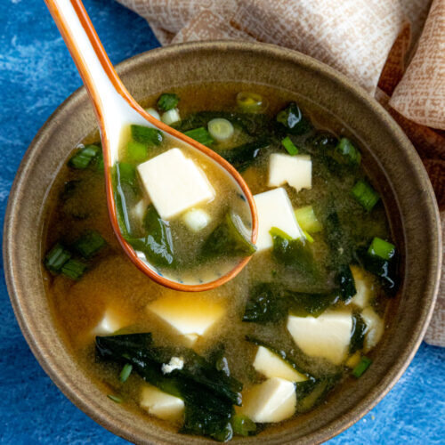 Mike taking a spoonful of homemade miso soup from the bowl