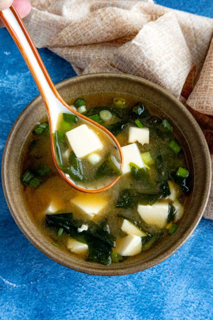Mike taking a spoonful of homemade miso soup from the bowl