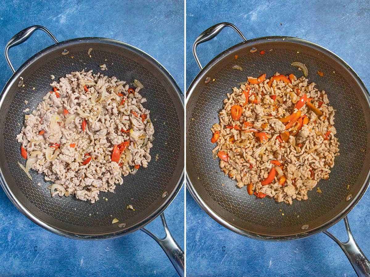 Stir frying ground pork with onions and spicy chilies in a wok to make pad kra pao (Thai Holy Basil Stir Fry)
