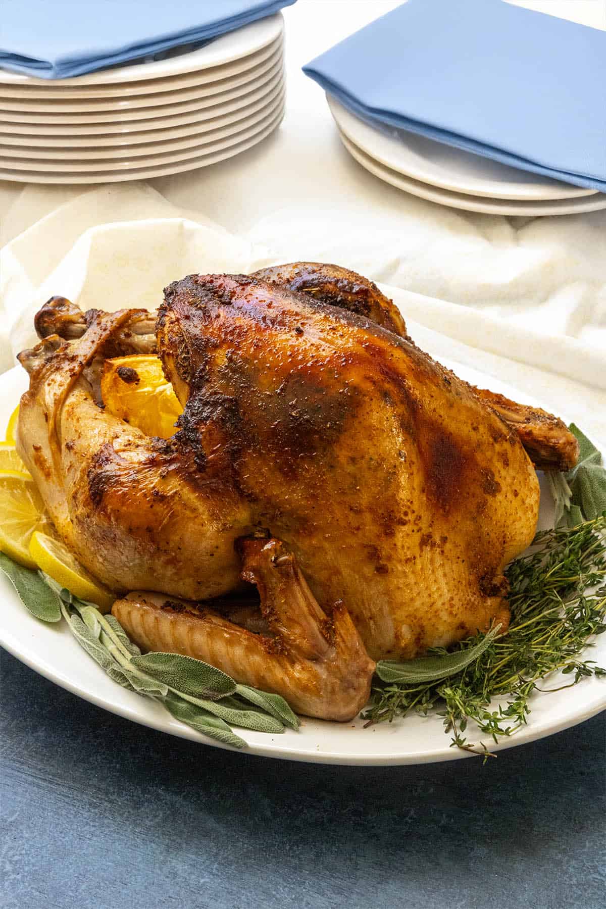 A roasted turkey with golden skin on a serving platter