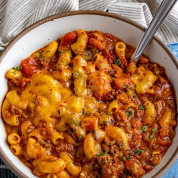 Cheesy Chili Mac in a serving bowl with a spoon