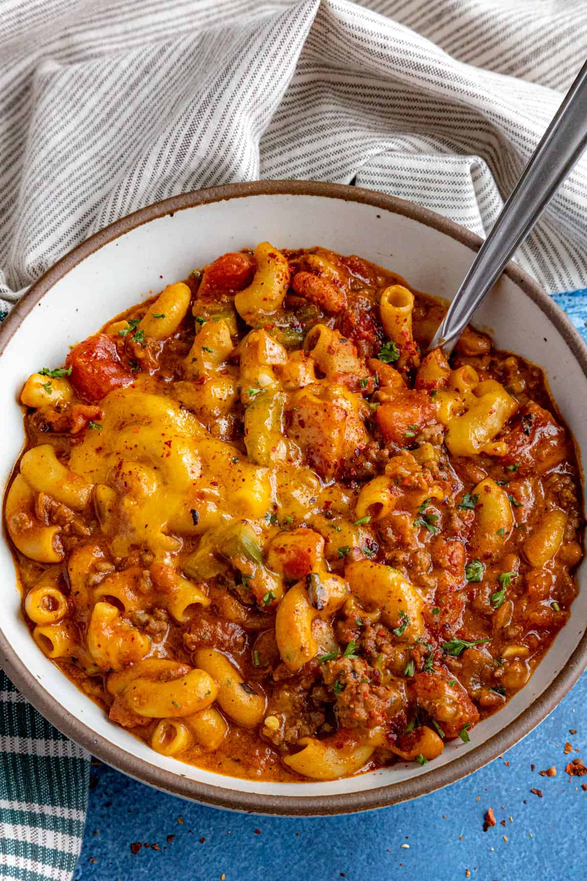 Cheesy Chili Mac in a serving bowl with a spoon
