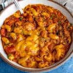 Comforting Chili Mac served in a bowl, covered with melted cheese