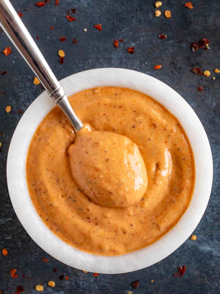 Creamy Mississippi comeback sauce in a bowl with a spoon for serving