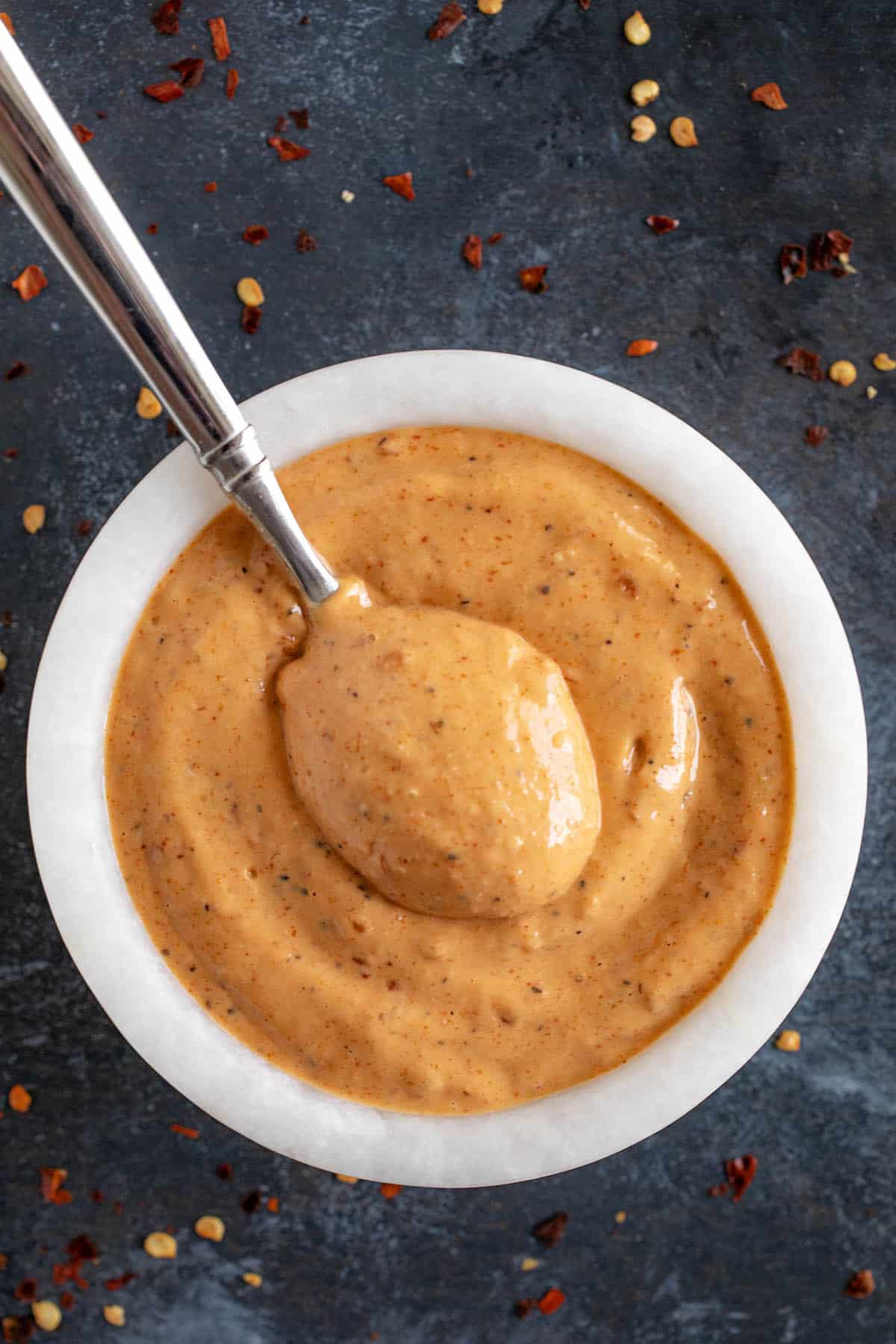 Creamy Mississippi comeback sauce in a bowl with a spoon for serving