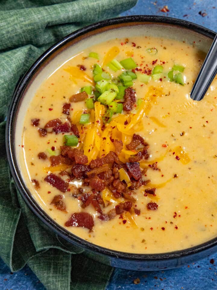 Like a baked potato in a bowl, creamy potato soup garnished with crumbled bacon, chives, and shredded cheddar cheese