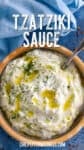 Homemade Tzatziki Sauce in a bowl drizzled with olive oil