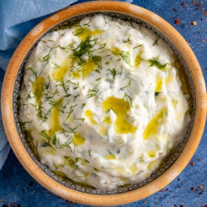 Homemade Tzatziki Sauce in a bowl topped with fresh dill