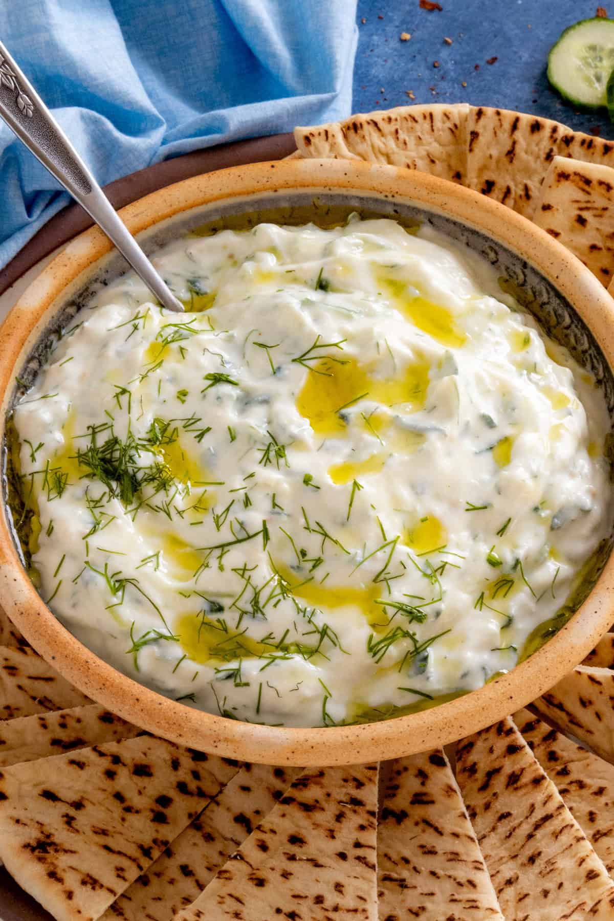 Homemade Tzatziki Sauce served on a plate with slices of pita bread