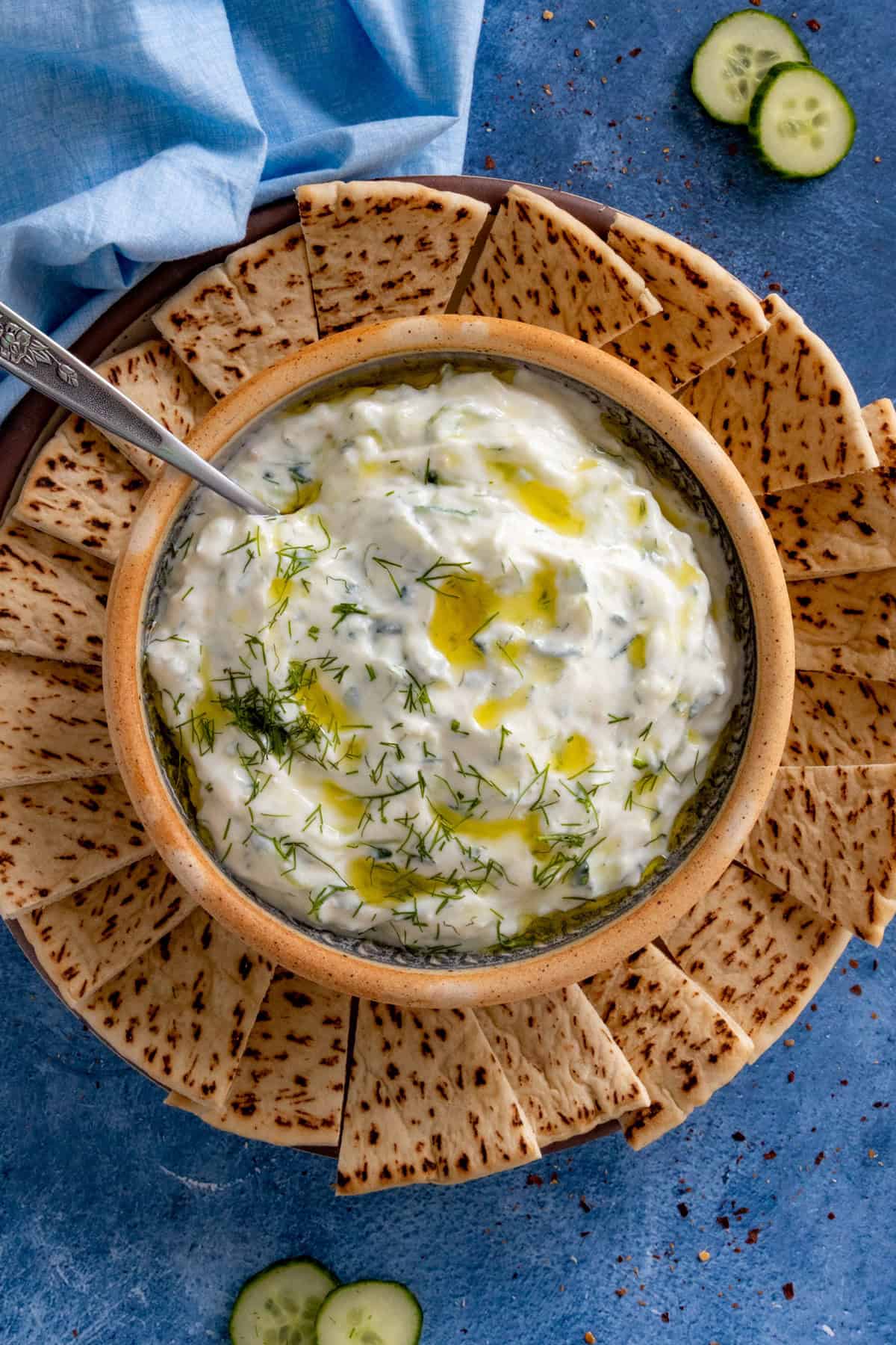 Homemade Tzatziki Sauce on a plate with pita slices