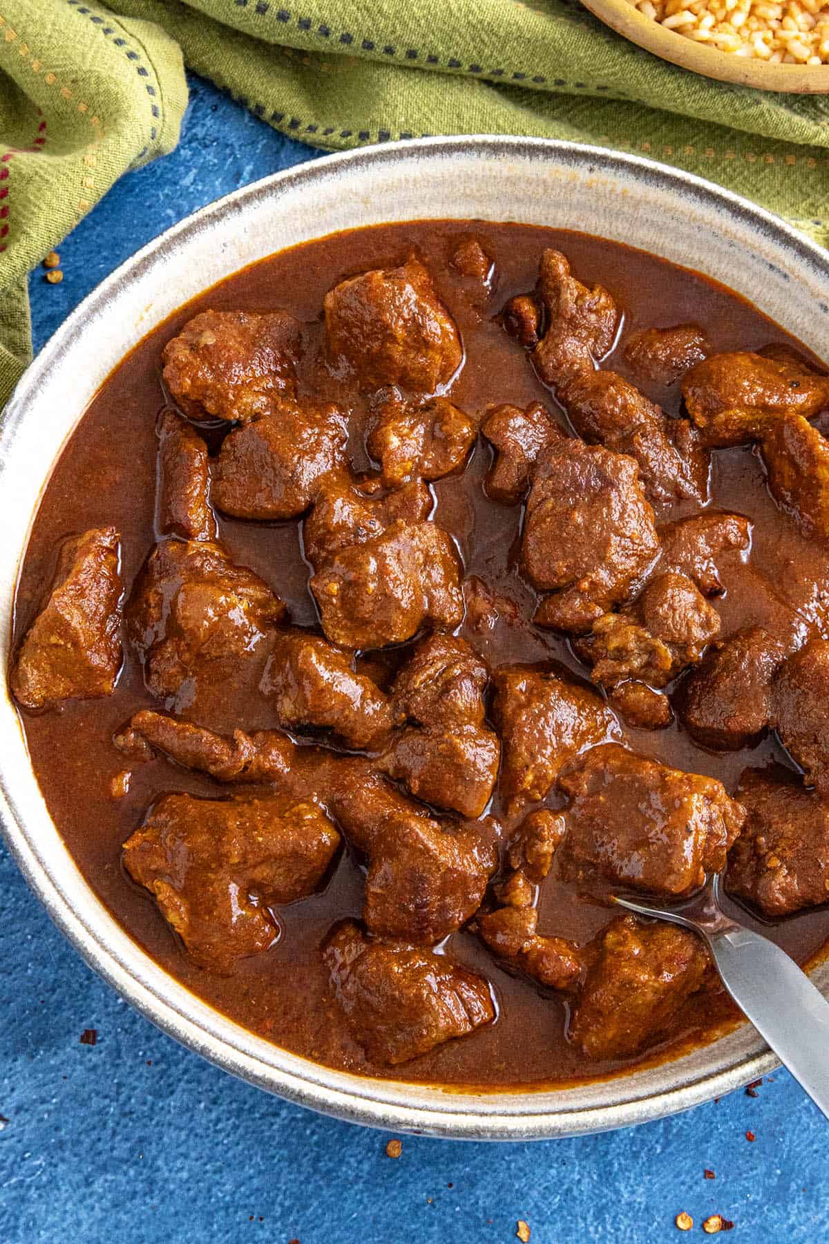 A saucy bowl filled with Mexican pork stew (asado de puerco)