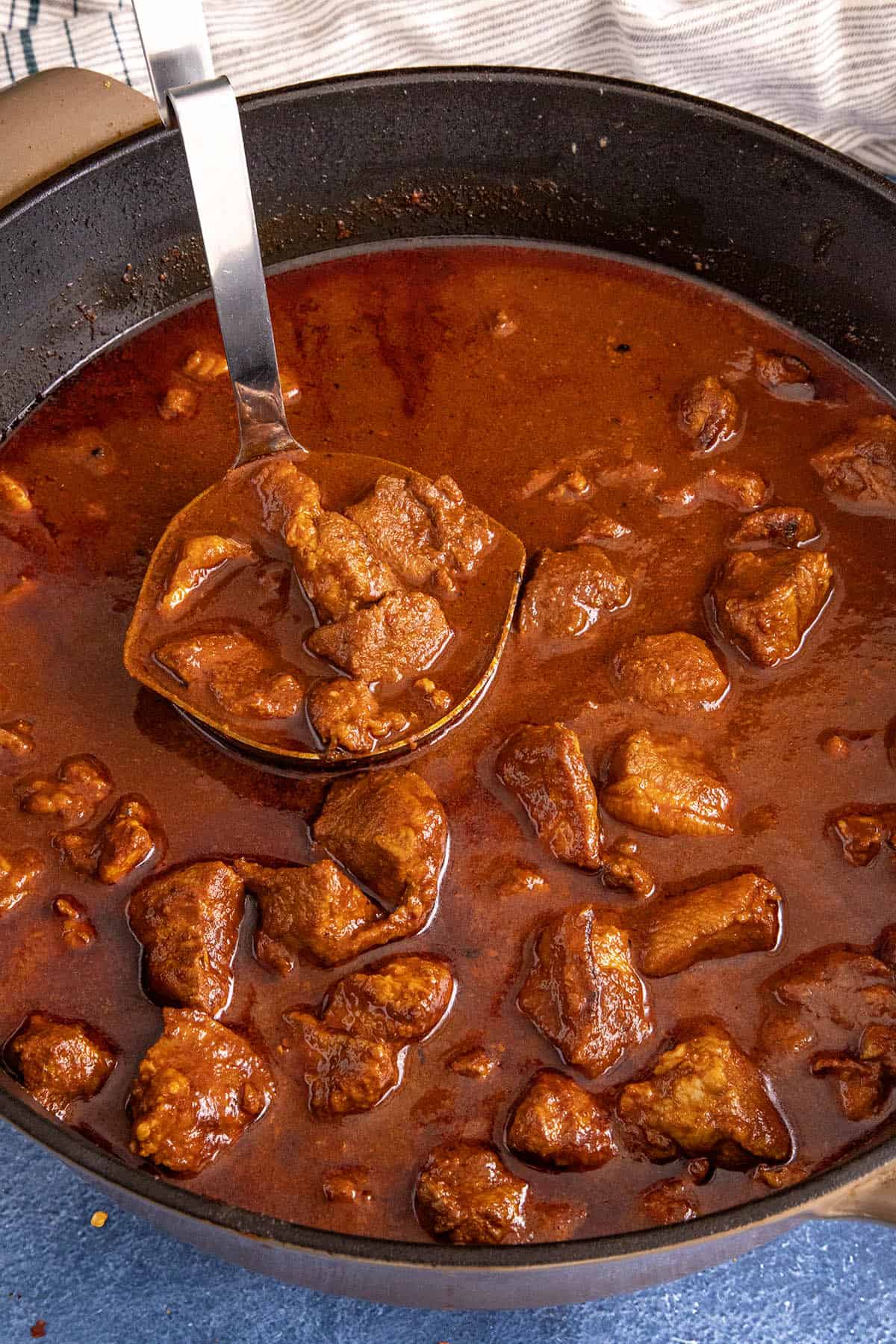 Asado de Puerco (Mexican Pork Stew) being served from the pot