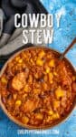 Hearty Cowboy Stew in a bowl, loaded with sausage, potatoes, and beans