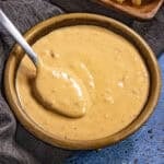 Samurai Sauce (Belgian spicy mayo) in a bowl with a spoon