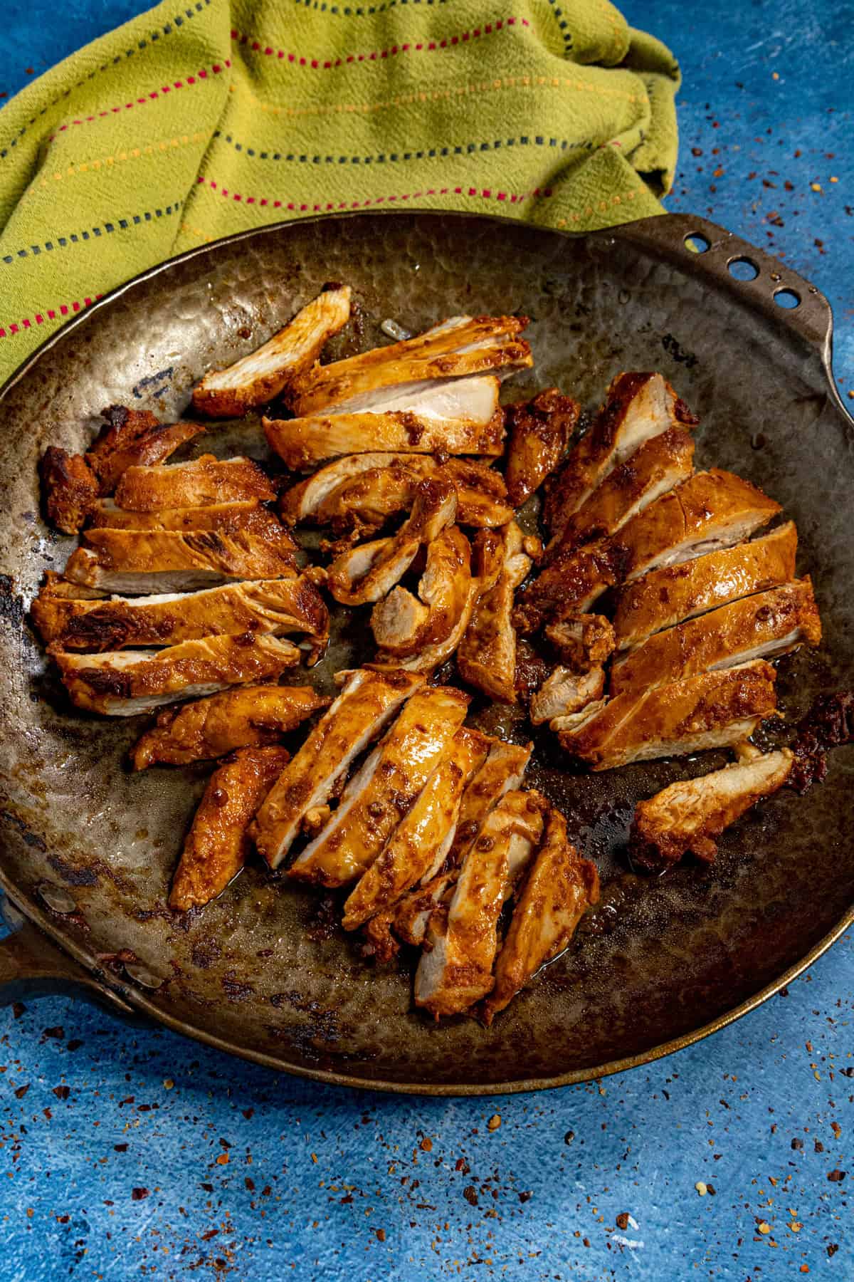 A pan filled with slices of spicy chipotle chicken