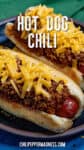 Hot dogs on a plate, topped with thick hot dog chili