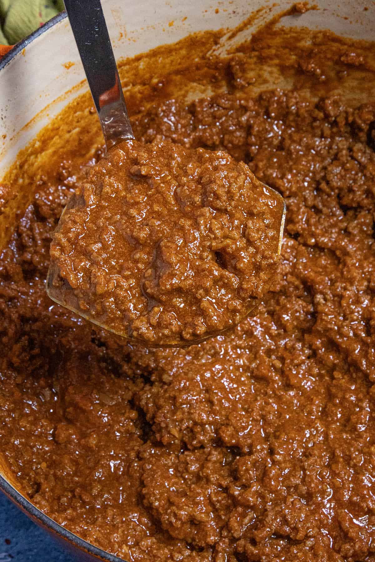 A large scoop of hot dog chili straight from the simmering pot