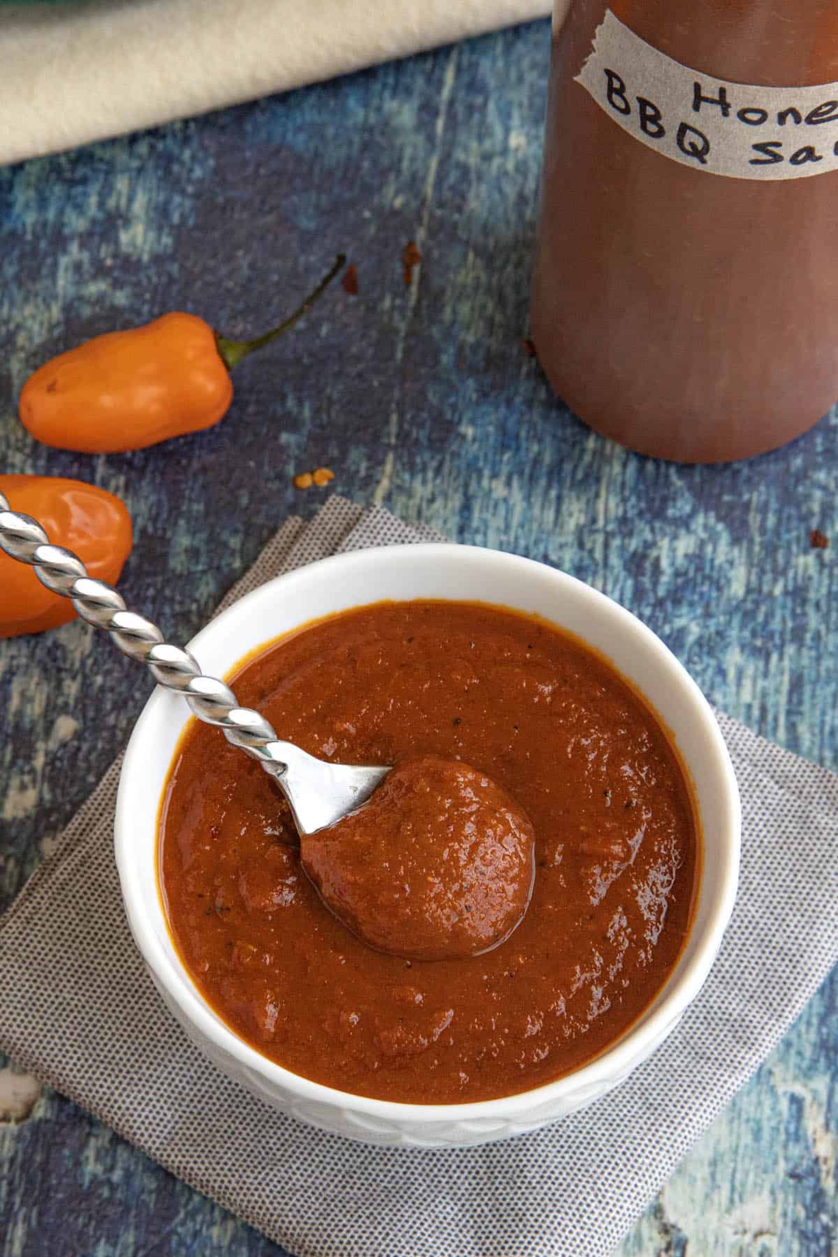 A white bowl filled with spicy habanero honey bbq sauce