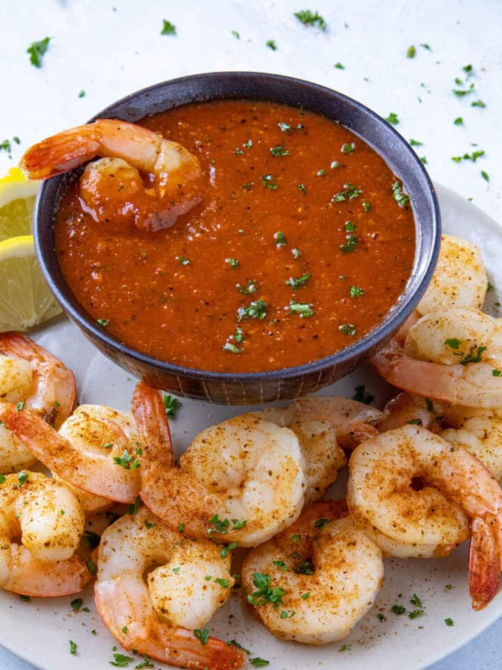 Zesty cocktail sauce served in a bowl with spicy seared shrimp