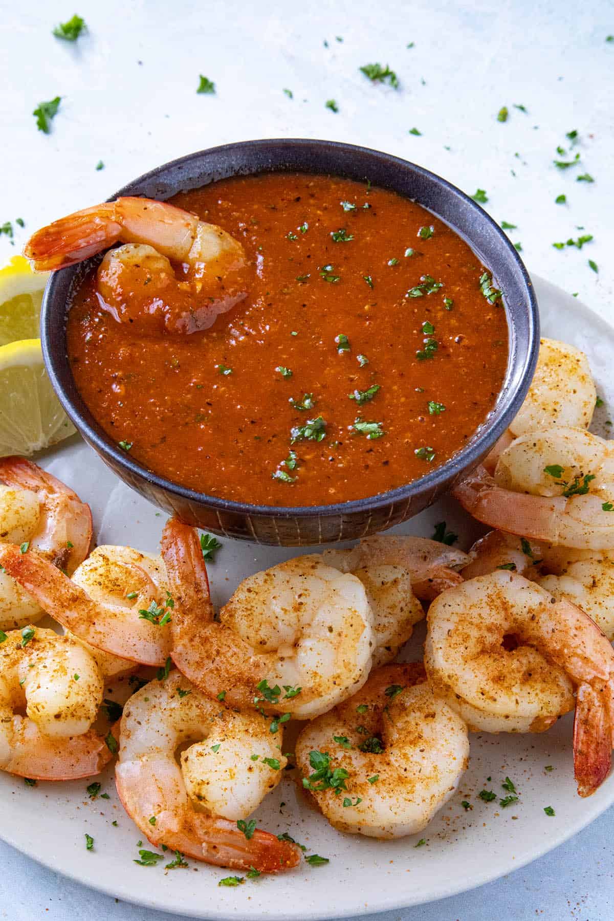Zesty cocktail sauce served in a bowl with spicy seared shrimp