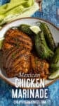 Grilled chicken with savory grill marks and roasted jalapeรฑos on a plate, garnished with lime wedges and herbs.
