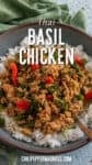 A bowl of Thai Basil Chicken served over white rice, garnished with Thai chilies and fresh basil leaves. Text on the image reads “Thai Basil Chicken” and “chilipeppermadness.com”. Perfect for fans of classic Thai flavors.