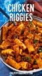 A bowl of Chicken Riggies pasta in creamy tomato sauce with peppers and spices, garnished with herbs from chilipeppermadness.com.