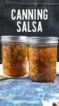 2 jars of canned salsa on a table