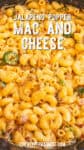 Creamy Jalapeno Popper Mac and Cheese mixed with sliced jalapeños and bits of bacon. Text on image reads: Jalapeno Popper Mac and Cheese. Website: chilipeppermadness.com.