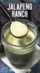 A spoon holds creamy Jalapeno Ranch Dressing above an open glass jar filled with the dip; text reads Jalapeno Ranch and chilipeppermadness.com appears at the bottom.