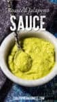 A marble bowl filled with creamy green Roasted Jalapeño Sauce, with a spoon inside. The text reads Roasted Jalapeño Sauce and chilipeppermadness.com.