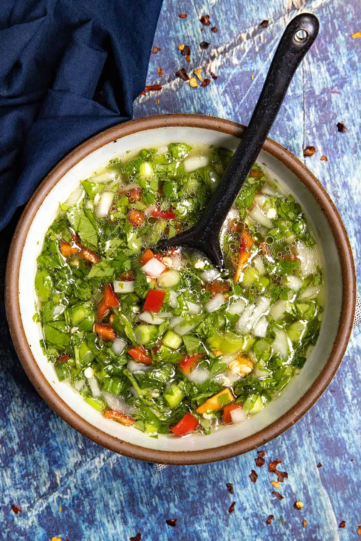 Zesty Aji Picante (Colombian Hot Sauce) in a small bowl with a serving spoon